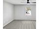 Clean, empty bedroom with two windows providing natural light and neutral carpet and paint at 7331 Livestock Rd, Mebane, NC 27302
