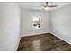 Bright bedroom with dark wood floor, neutral walls, and ceiling fan offers a serene retreat at 7331 Livestock Rd, Mebane, NC 27302