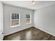 Compact bedroom with hard wood floors, ample natural light, and neutral paint at 7331 Livestock Rd, Mebane, NC 27302