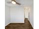 An empty bedroom with neutral walls and dark-colored hardwood floors at 7331 Livestock Rd, Mebane, NC 27302