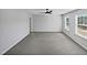 An empty bedroom with neutral walls, ceiling fan, and carpeted floors at 7331 Livestock Rd, Mebane, NC 27302