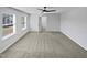 Bright bedroom boasts soft carpet, a ceiling fan, and an open doorway creating an inviting space at 7331 Livestock Rd, Mebane, NC 27302