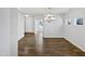 Bright dining area featuring hardwood floors and modern chandelier lighting at 7331 Livestock Rd, Mebane, NC 27302