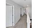 Bright hallway with neutral walls, leading to multiple rooms at 7331 Livestock Rd, Mebane, NC 27302