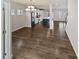 Open-concept living area with hardwood floors, view of modern kitchen and dining area, and ample space at 7331 Livestock Rd, Mebane, NC 27302