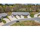 Stunning aerial view of townhomes with long driveways and attached garages surrounded by mature trees at 818 Houston Ct, Haw River, NC 27258