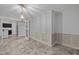 Elegant dining room featuring decorative molding, a stylish chandelier, and plush neutral carpet at 818 Houston Ct, Haw River, NC 27258