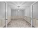 Elegant dining room with decorative molding, a stylish chandelier, and plush neutral carpet at 818 Houston Ct, Haw River, NC 27258
