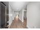 Inviting foyer with wood-look floors leading to a light-filled interior and bathroom at 818 Houston Ct, Haw River, NC 27258