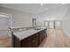 Open-concept kitchen with breakfast bar overlooking the dining and living areas, offering seamless flow at 818 Houston Ct, Haw River, NC 27258