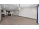 Spacious living area featuring wood-look floors, recessed lighting, and views into the modern kitchen at 818 Houston Ct, Haw River, NC 27258