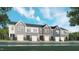 Charming townhome exteriors featuring attached garages, varied siding and classic architectural details at 868 Pilot St # 2, Haw River, NC 27258