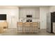 Stylish kitchen with an island, bar seating, and modern appliances at 868 Pilot St # 2, Haw River, NC 27258