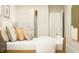 Comfortable bedroom with a bed, soft bedding, and a view into a closet at 868 Pilot St # 2, Haw River, NC 27258