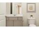 Well-lit bathroom featuring a modern vanity, mirror, and fixtures at 874 Pilot St # 5, Haw River, NC 27258