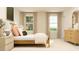 Bright bedroom with large windows, elegant furnishings, and a stylish bed at 874 Pilot St # 5, Haw River, NC 27258