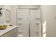 Modern bathroom featuring a sleek shower with sliding glass doors and neutral finishes at 883 Pilot St # 48, Haw River, NC 27258