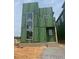 Modern home under construction with ZIP System sheathing, featuring a unique multi-level design and window placement at 95 Parkland Dr, Pittsboro, NC 27312