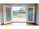 View of the backyard and wood deck seen through french doors and hardwood floors at 96 Overlook Rd, Cameron, NC 28326