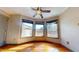 A bedroom with a ceiling fan and a large bay window for lots of natural sunlight at 96 Overlook Rd, Cameron, NC 28326