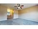A large bedroom features neutral walls, ceiling fan, and adjoins a bathroom with double vanities at 96 Overlook Rd, Cameron, NC 28326