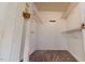 A view of a walk in closet with white walls, a carpeted floor, and wire shelving at 96 Overlook Rd, Cameron, NC 28326