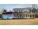 Charming two-story home featuring a spacious front porch and a two-car garage at 96 Overlook Rd, Cameron, NC 28326