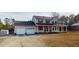 A charming two-story home with a large covered front porch, and a detached two-car garage at 96 Overlook Rd, Cameron, NC 28326
