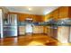 A kitchen with wood cabinets, granite countertops, stainless steel appliances and tile backsplash at 96 Overlook Rd, Cameron, NC 28326