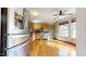A large kitchen with stainless steel appliances, light wood cabinets, and lots of sunlight at 96 Overlook Rd, Cameron, NC 28326