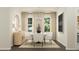 Elegant dining room with a modern chandelier, sleek furniture, and ample natural light at 0 Hanover Way, Sanford, NC 27330