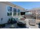 Cozy back patio features a fire pit, television, privacy fence, and comfortable seating at 1025 Chelsea Run Ln, Apex, NC 27502