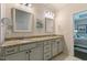Bathroom features granite countertops, framed mirrors, and access to main bedroom at 1025 Chelsea Run Ln, Apex, NC 27502