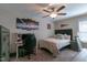 Bedroom featuring a ceiling fan, desk, and black upholstered gaming chair for the ultimate gaming experience at 1025 Chelsea Run Ln, Apex, NC 27502