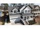 Beautiful two-story home boasts an attached two-car garage and a cozy front porch at 1025 Chelsea Run Ln, Apex, NC 27502