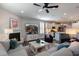 Open concept living room with fireplace, tv, and view of the kitchen and dining area at 1025 Chelsea Run Ln, Apex, NC 27502