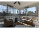 Relaxing screened-in porch with comfortable seating, a ceiling fan, and a view of the backyard at 1025 Chelsea Run Ln, Apex, NC 27502