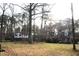 Traditional home featuring dormer windows and a brick facade, set on a lush lot with mature trees at 105 Mary St, Carrboro, NC 27510