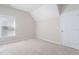 The attic bedroom has carpet and a window with blinds at 1100 Dotson Way, Apex, NC 27523