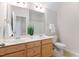 Bathroom includes a double sink vanity, large mirror, and shower-tub combination at 1100 Dotson Way, Apex, NC 27523