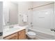 This bathroom features a vanity, toilet, and tub with shower at 1100 Dotson Way, Apex, NC 27523