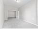 Large room with neutral paint and carpet, featuring an open doorway and recessed lighting at 1100 Dotson Way, Apex, NC 27523