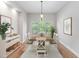 Formal dining room with modern decor, hardwood floors and decorative lighting at 1100 Dotson Way, Apex, NC 27523
