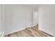 Bright bedroom featuring wood-look flooring and white walls at 113 Ellen Pl, Chapel Hill, NC 27514