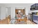 Eat-in kitchen featuring view of living room with shiplap and wood accent wall at 113 Ellen Pl, Chapel Hill, NC 27514