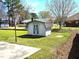 Backyard featuring a shed, and grassy area at 117 Woodcroft Drive Dr, Angier, NC 27501