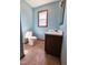 Cozy bathroom with blue walls, tiled flooring, and vanity sink at 117 Woodcroft Drive Dr, Angier, NC 27501