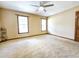 Bedroom featuring neutral carpet, ceiling fan, two windows and a butterfly decorative piece at 117 Woodcroft Drive Dr, Angier, NC 27501