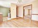 Open dining area flowing into the kitchen and living spaces, highlighting the hardwood floors at 117 Woodcroft Drive Dr, Angier, NC 27501