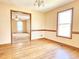 Bright dining room with hardwood floors, natural light, and traditional chandelier fixture at 117 Woodcroft Drive Dr, Angier, NC 27501